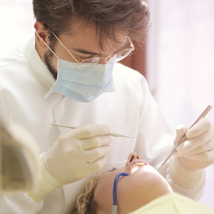 A dentist performs a root canal