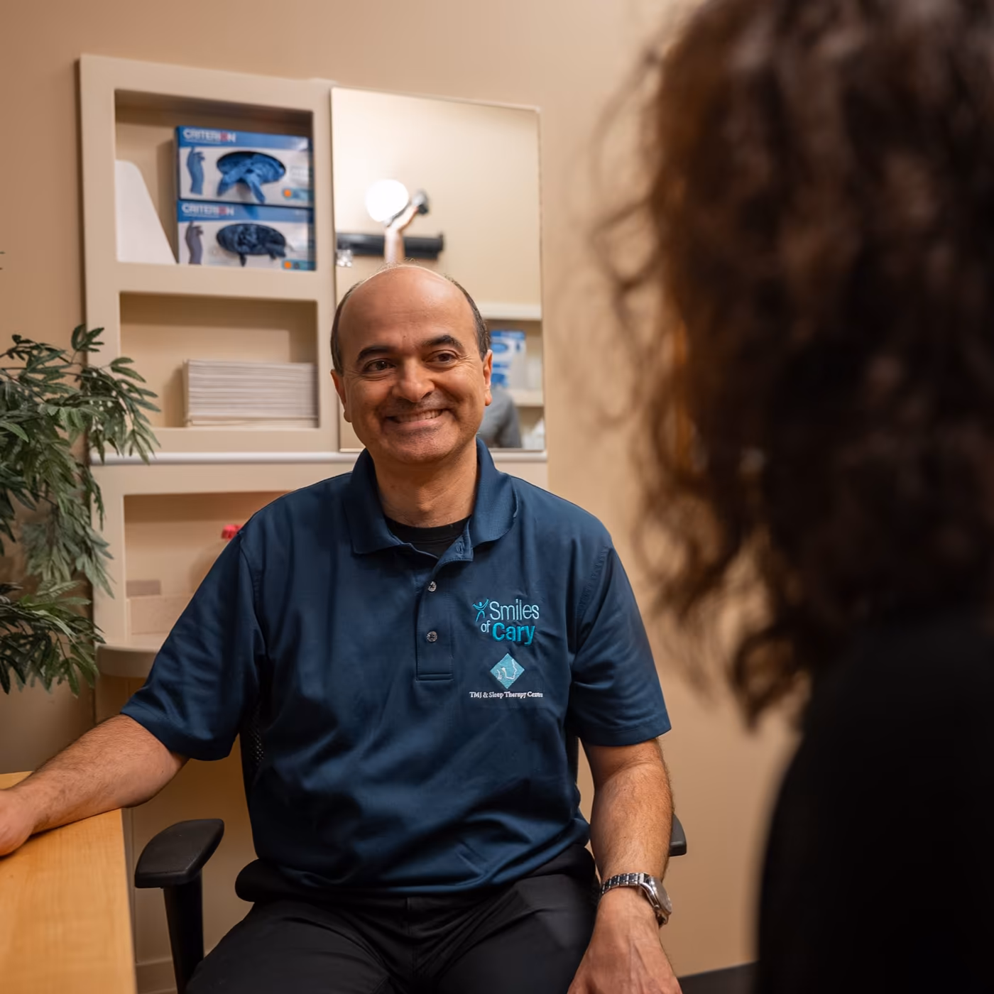 Dr. Charles Ferzli in a consultation with a patient at Smiles of Cary