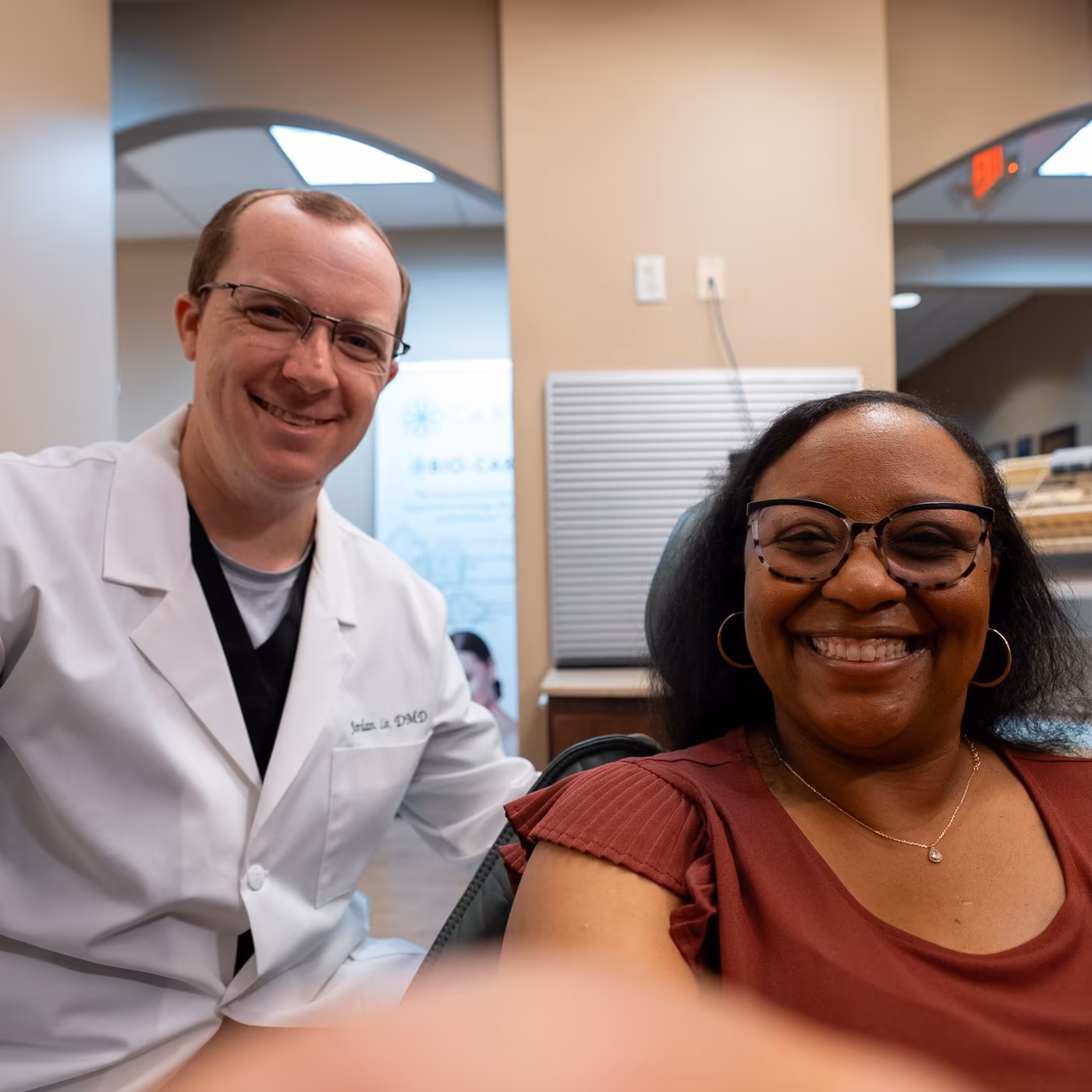 Dr. Jordan Lee with a smiling patient in the treatment chair at Smiles of Cary