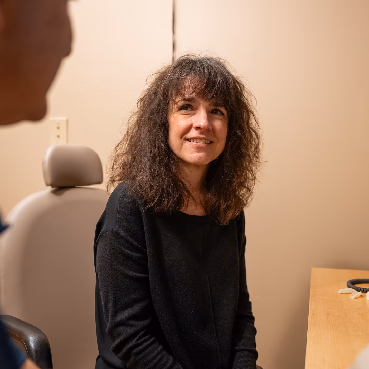 A patient smiling during a consultation at Smiles of Cary