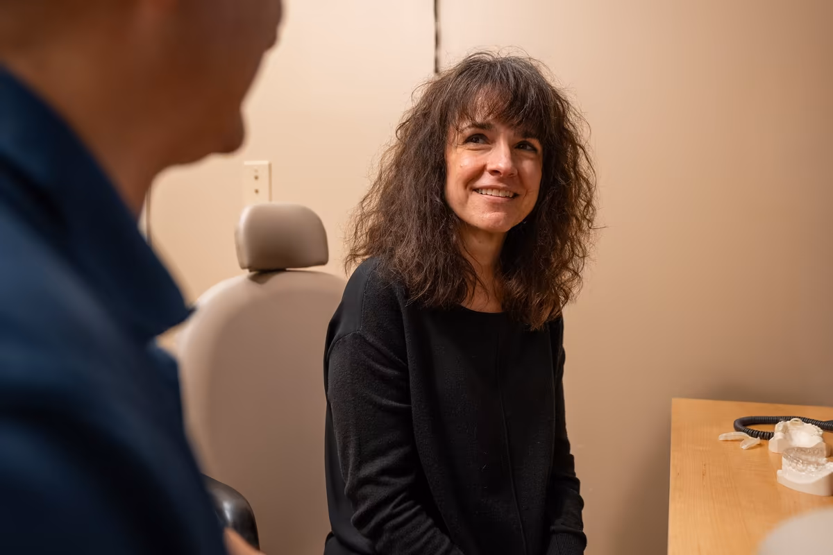 A patient smiling during a consultation at Smiles of Cary