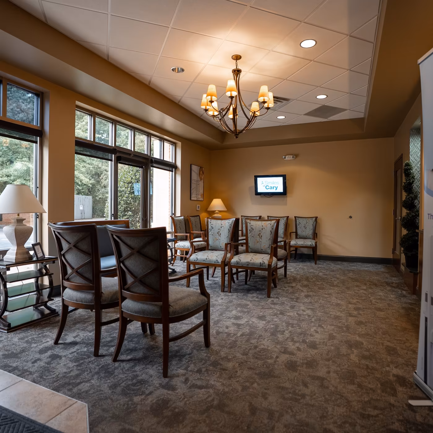 The window-lit patient waiting room at Smiles of Cary in Cary, NC